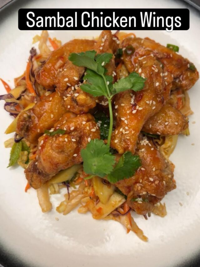 It starts off sweet… and then 🔥

These sambal chicken wings come in sweet, sticky, and with bold sambal flavour — sweet at first and that slow-building heat kicks in 🔥 Eight pieces, perfectly glazed and a little messy. 
We’ve paired them with a fresh green mango salad for that crisp, tangy balance 🥭